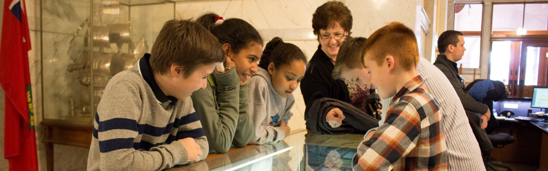 Students standing beside an exhibit, Harriet Tubman School