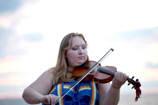 Métis Nation of Ontario woman playing the fiddle