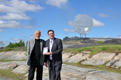 Ted and Jim Szilva standing near the Big Nickel