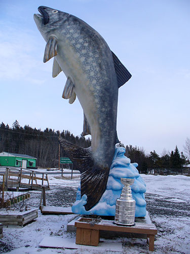 Stanley Cup in front of large fish, Larder Lake, Ontario