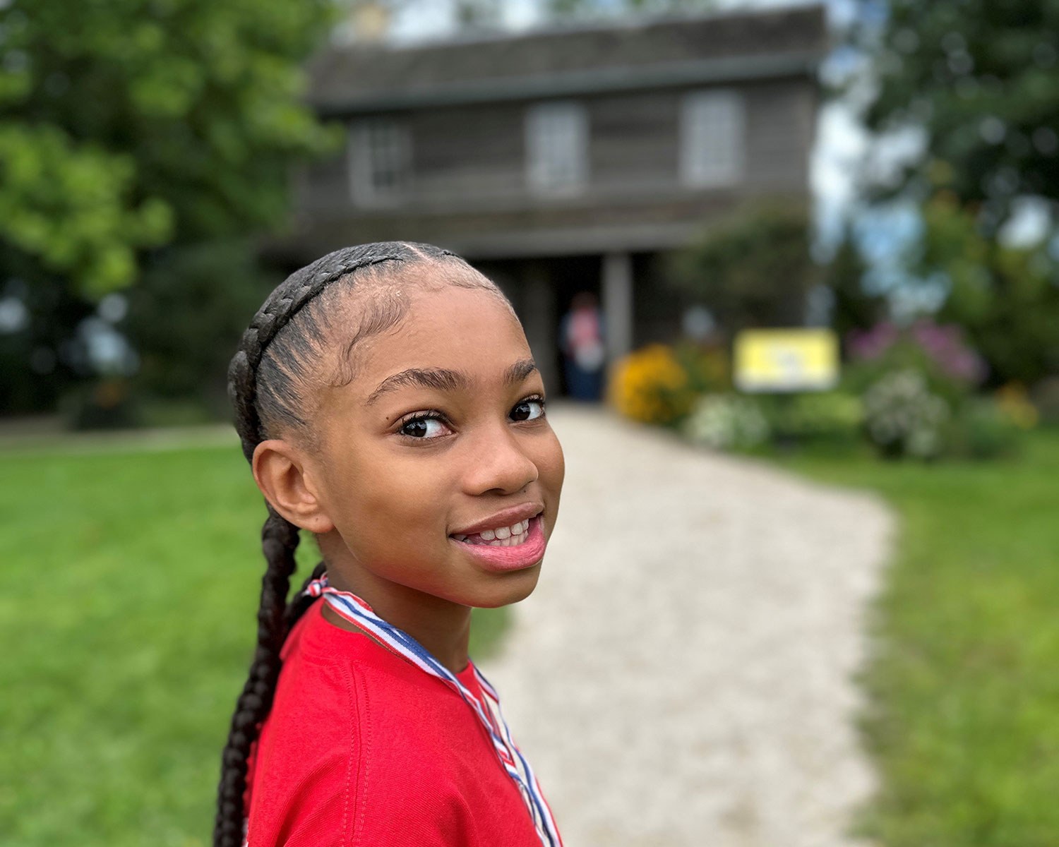 Little girl in front of the Josiah Henson Museum of African-Canadian History