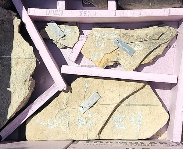 The limestone foundation was placed into wooden containers and will remain in storage until the reconstruction of the stone foundation can begin at some future date