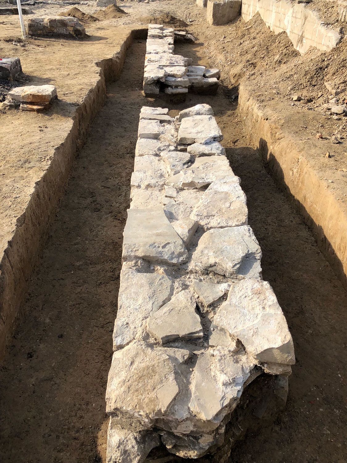 The limestone foundation of the south wall of the First Parliament south building excavated