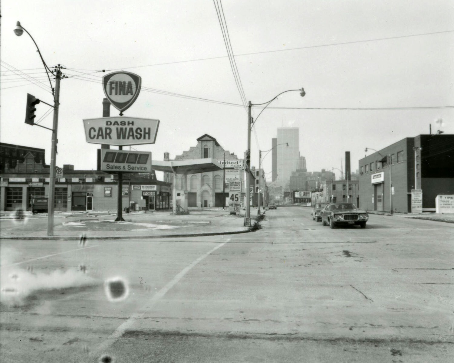 A photograph taken by Don Ritche in 1973 at the intersection of Parliament and Front streets. You can see the gas station and Fina Dash Car Wash that occupied the First Parliament site at the time. (Photo: Toronto Public Library)