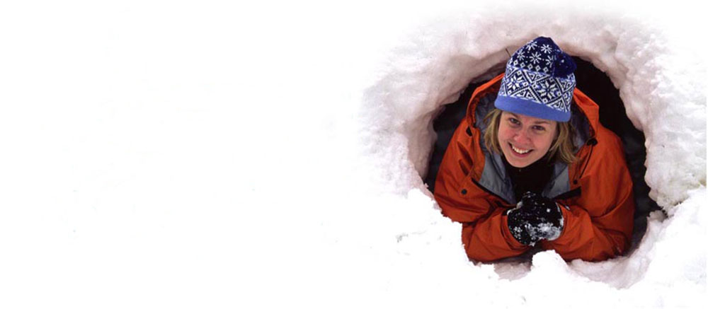 Woman tunnelling in snow