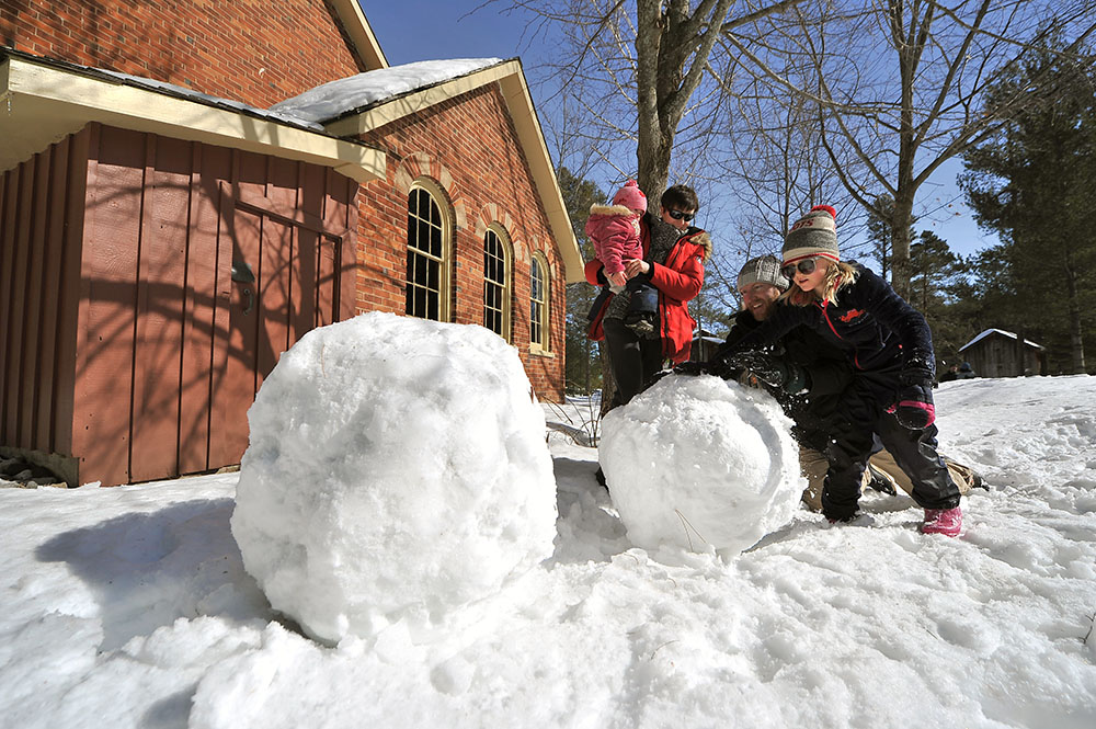 Family playing in the snow