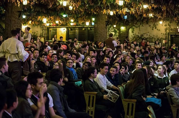 High school students enjoying a production of Twelfth Night in the Winter Garden Theatre.